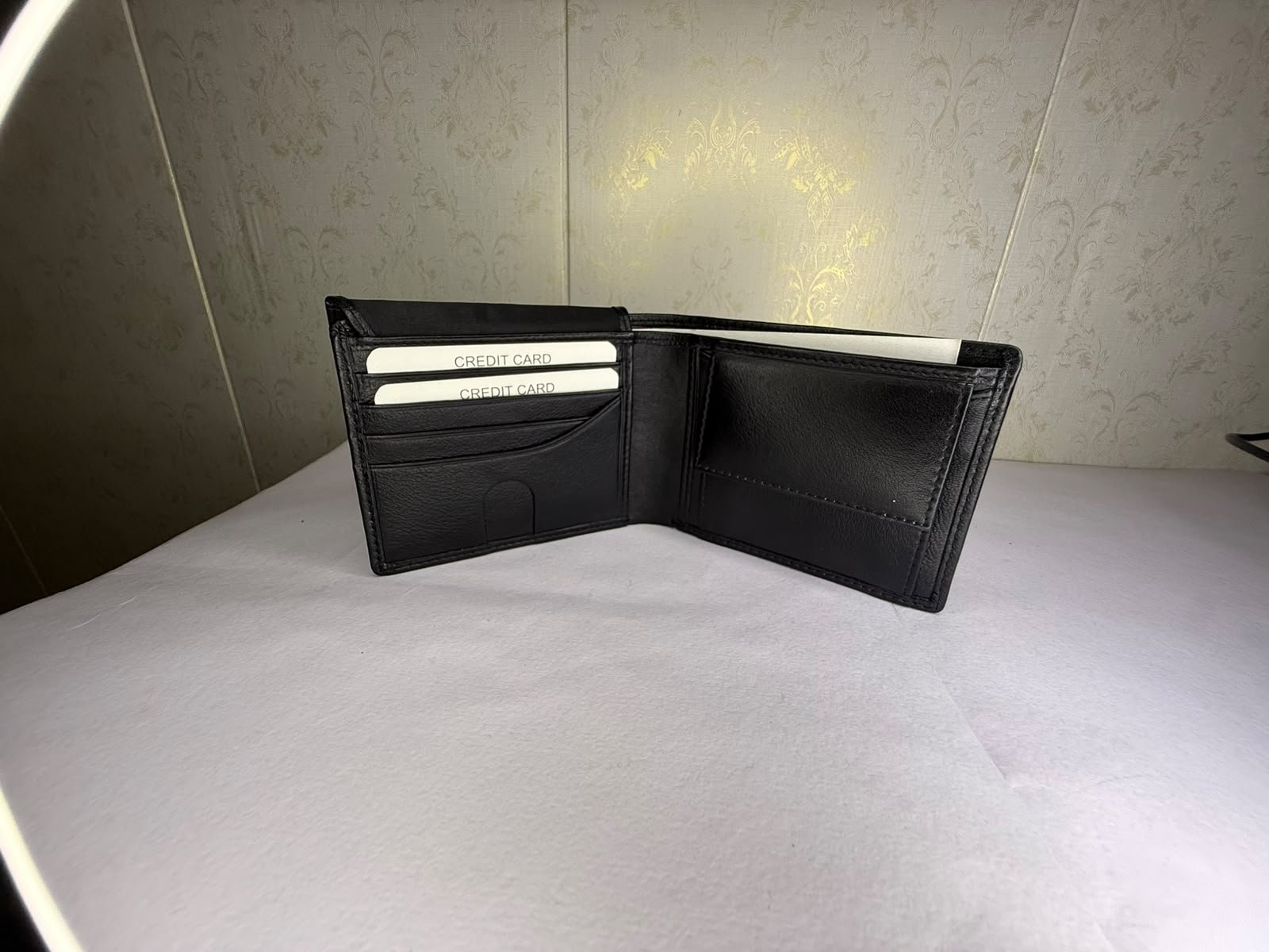 Open black leather bifold wallet